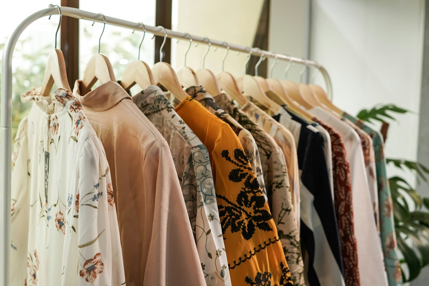 Patterned blouses on a rail
