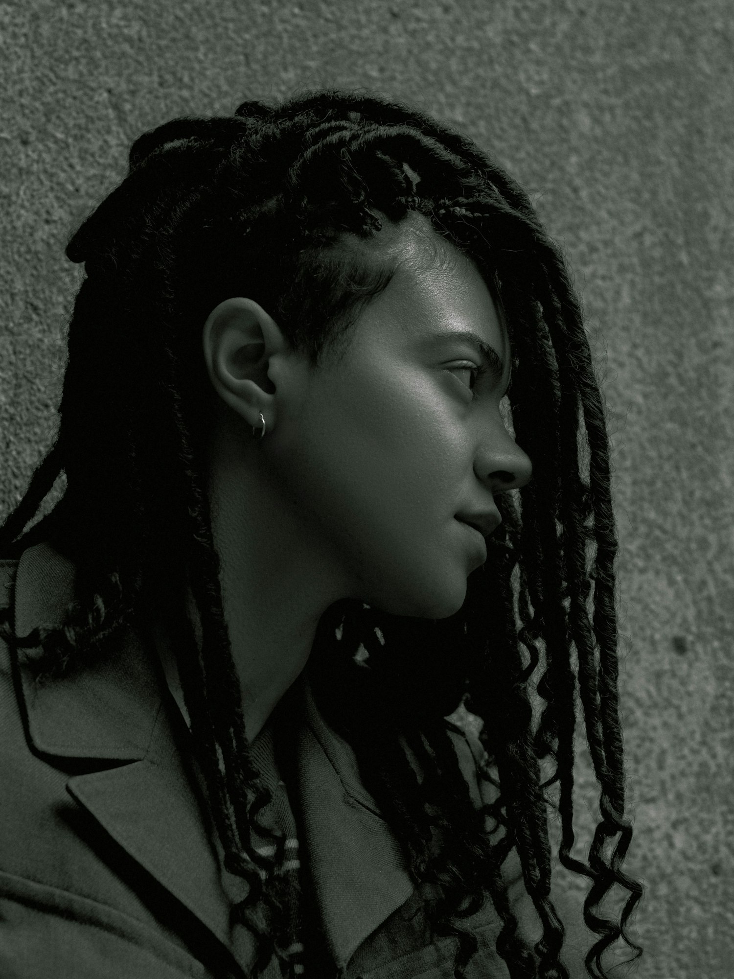 Black and white portrait with long locs