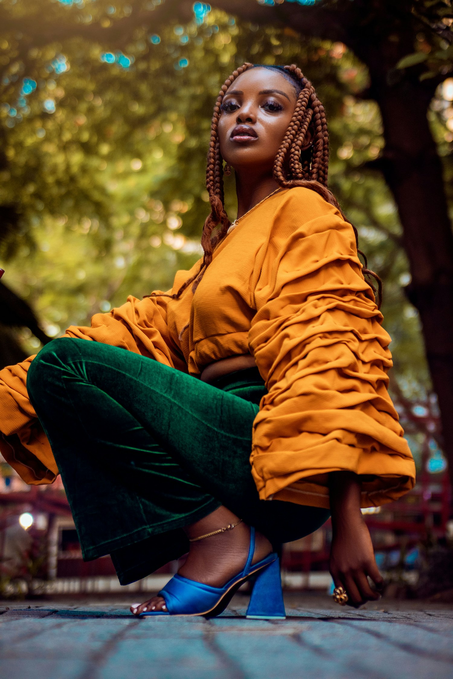 Woman in a bright outfit sitting on the ground